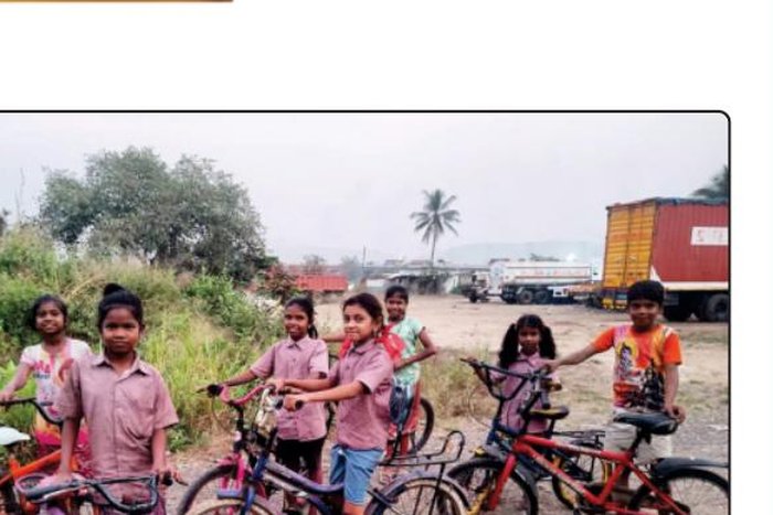 Bicycles being distributed to children in a tribal hamlet