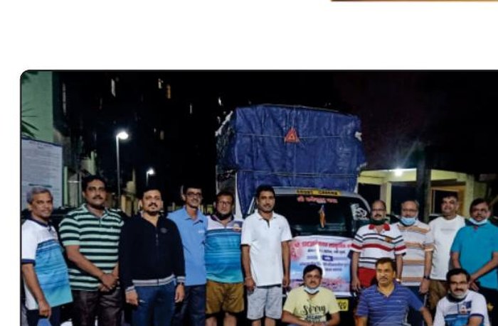 Volunteers distributing essential supplies to Kolhapur flood victims